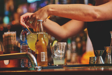 Female barman preparing drinks. cocktail bar Drinks at the bar. Fresh and cold drinks in a bar. Watermelon drink, jamiaca drink, margarita, micheladas.