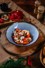 Fried fish, shrimp and roasted peppers. Top view