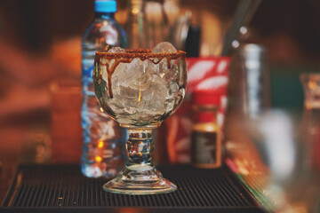 Female barman preparing drinks. cocktail bar Drinks at the bar. Fresh and cold drinks in a bar. Watermelon drink, jamiaca drink, margarita, micheladas.