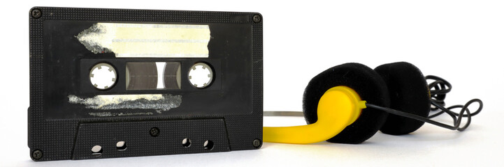 Vintage Cassette tape and headphones isolated on a white background