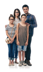 Our family is fashion forward. Studio shot of trendy young family against a white background.