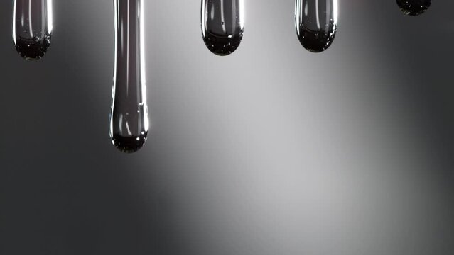 Super Slow Motion Macro Shot of Dripping Oily Liquid on Dark Grey Background at 1000 fps.