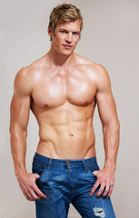 Fototapeta premium Ive worked for this body. Portrait of a muscular young man posing in studio.