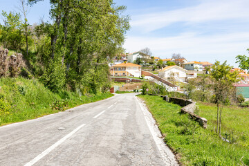 N2 paved road passing through Grandal (Penude) village, Lamego municipality, district of Viseu, Portugal - obrazy, fototapety, plakaty