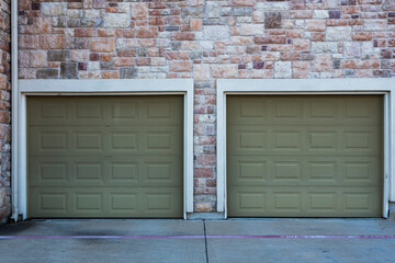 Garage doors on a brick wall