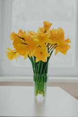Bouquet of daffodils in vase on table