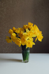Bouquet of daffodils in vase on table
