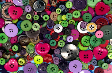 Collection of colorful sewing plastic buttons background