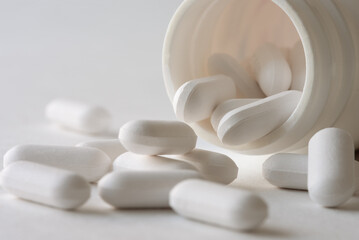 Fototapeta na wymiar Acetaphetamine Tablets Spilled from a Bottle