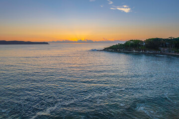 Aerial sunrise seascape with clear skies