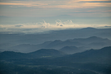 Obraz premium colorful sunrise at the highest peak of Mount Si Kunir, Mount Dieng, Wonosobo, Indonesia 