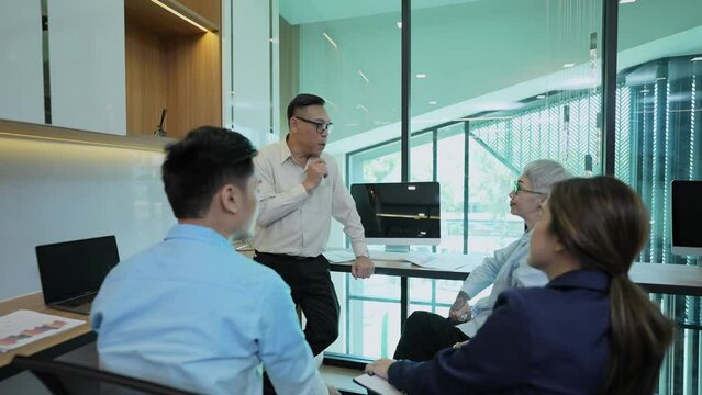 Business concept of 4k Resolution. Asian young business people group have discussion meeting in office. casual business plan.