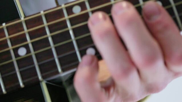 playing the guitar solo close up