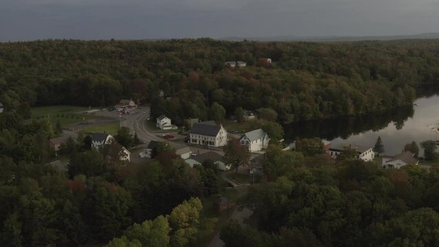 Monson Town, Maine in early Fall orbiting aerial view 