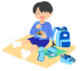 お弁当を食べている男の子