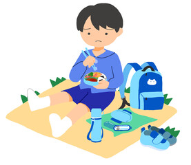 外でお弁当を食べている男の子