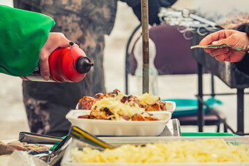 cooking and selling barbecue on the street in the field, hot meat food