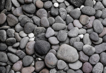 Full frame of pile of different shades of grey stones