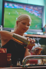 Female barman preparing drinks. cocktail bar Drinks at the bar. Fresh and cold drinks in a bar. Watermelon drink, jamiaca drink, margarita, micheladas.