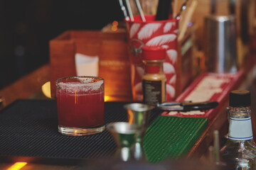 Female barman preparing drinks. cocktail bar Drinks at the bar. Fresh and cold drinks in a bar. Watermelon drink, jamiaca drink, margarita, micheladas.