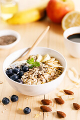 Healthy breakfast with yogurt, granola and fresh blueberries.