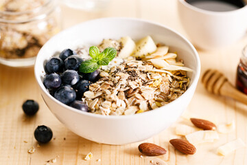 Healthy breakfast with yogurt, granola and fresh blueberries.