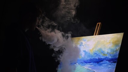 Artist copyist paint seascape with ship in ocean. Vaper smoke vape e-cigarette. Craftsman decorator draw as boat sail on blue sea with acrylic oil color. Draw finger, brush, knife palette. Indoor.