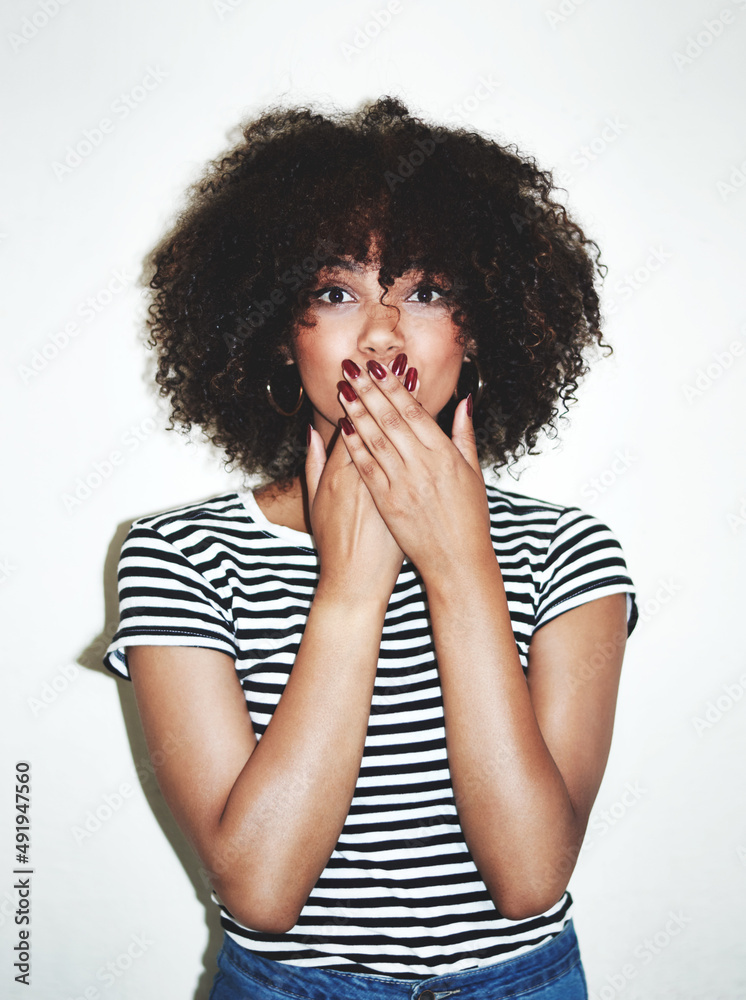 Canvas Prints Did I do that. Studio shot of an attractive young woman looking shocked against a gray background.