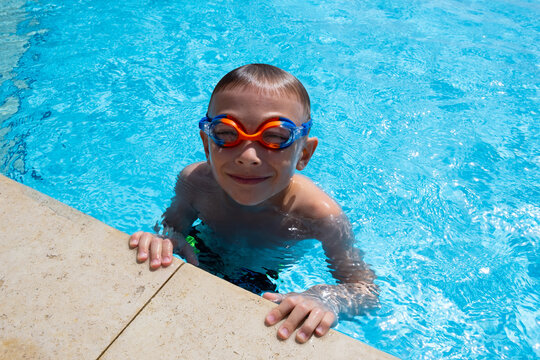 little boy swimming in the pool