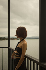 Young woman looking at the sea.