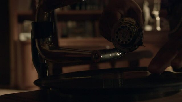 Old vinyl record player in a library in a hacienda style home.