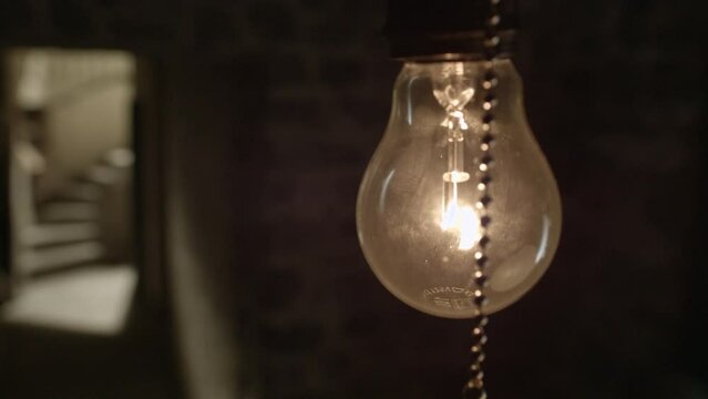 Lightbulb in a dark corner of a basement