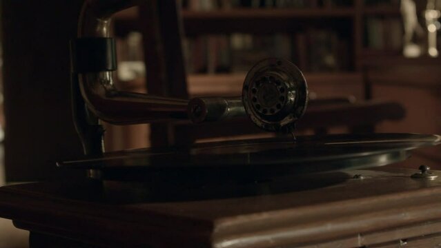 Old vinyl record player in a library in a hacienda style home.