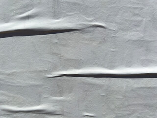 Close up detail of a wrinkled white empty street poster 