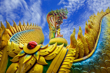 Buddha and Naga statues at Wat Tham Pha Daen, Sakon Nakhon Province, Thailand
