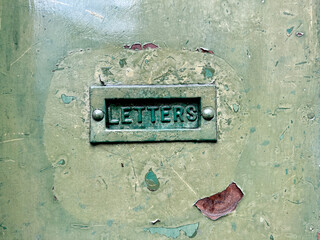 Old weathered antique vintage door letter box