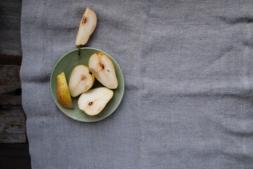 Beautiful food styling of sliced pear on a green vintage plate 
