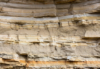 Geological layers of earth - layered rock. Close-up of sedimentary rock - Powered by Adobe