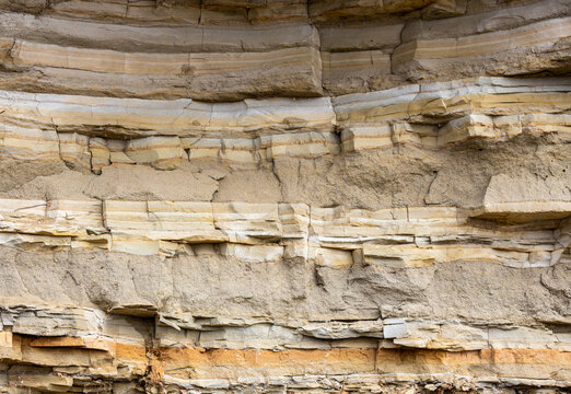 Geological layers of earth - layered rock. Close-up of sedimentary rock