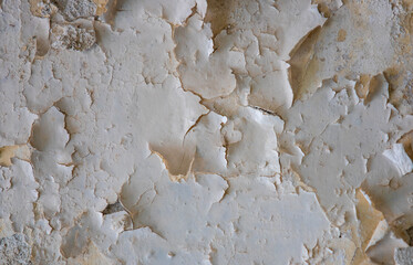 a close-up with peeling paint on the wall
