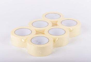 masking tape stands on a white background. adhesive paint protection tape. Painters and people who...