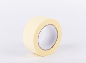 masking tape stands on a white background. adhesive paint protection tape. Painters and people who paint use this material.