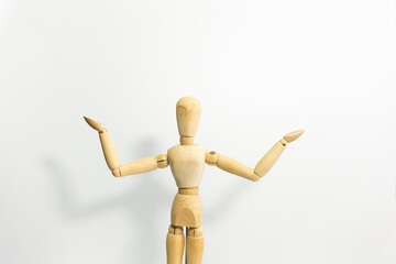 wooden mannequin standing, opening the arms