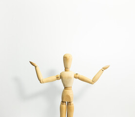 wooden mannequin standing, opening the arms