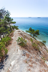 Beautiful summer landscape. View of the forest, rocks and sea coast. Hiking in scenic areas, the road to the wild beach. The resort town of Gelendzhik. Russia, Black sea coast