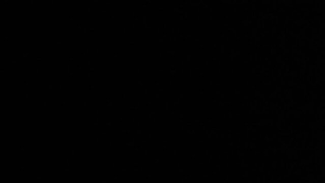 Mobile phone camera close-up on a black background with police flashing beacons