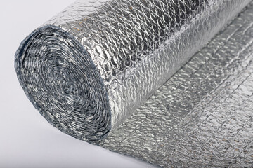 silver thermal insulation material stands on a white background.