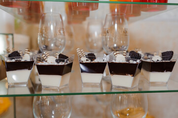 Sweet cakes at a wedding banquet. Catering, sweet festive buffet. Candy bar