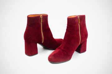 
Burgundy red manchester shoes. Ankle boots but heel. Isolated with gray background.