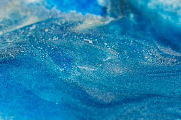 Liquid paint art. Macro ink background. Blue colors mix